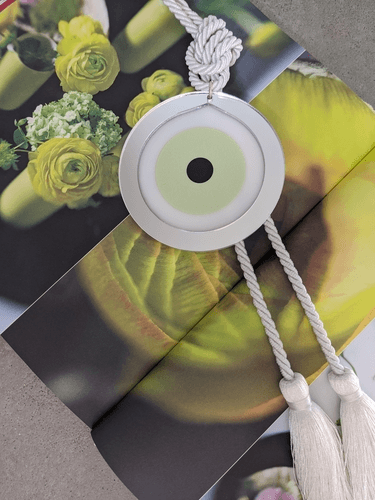 Acrylic Evil Eye wall hanging decoration Green with grey tassel - stylish luck home decor