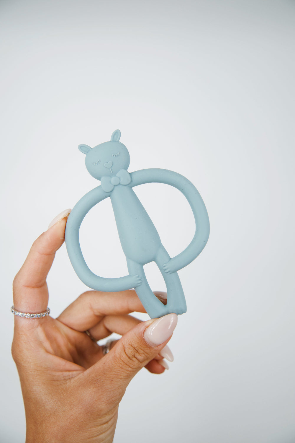 A light blue cat-shaped baby teether 