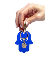 Load image into Gallery viewer, Blue acrylic Hamsa key holder with gold plated Hamsa &amp; evil eye charm - Stylish Luck Home Decor | Hamsa \ Hand Of Fatima | Good Luck Gifts